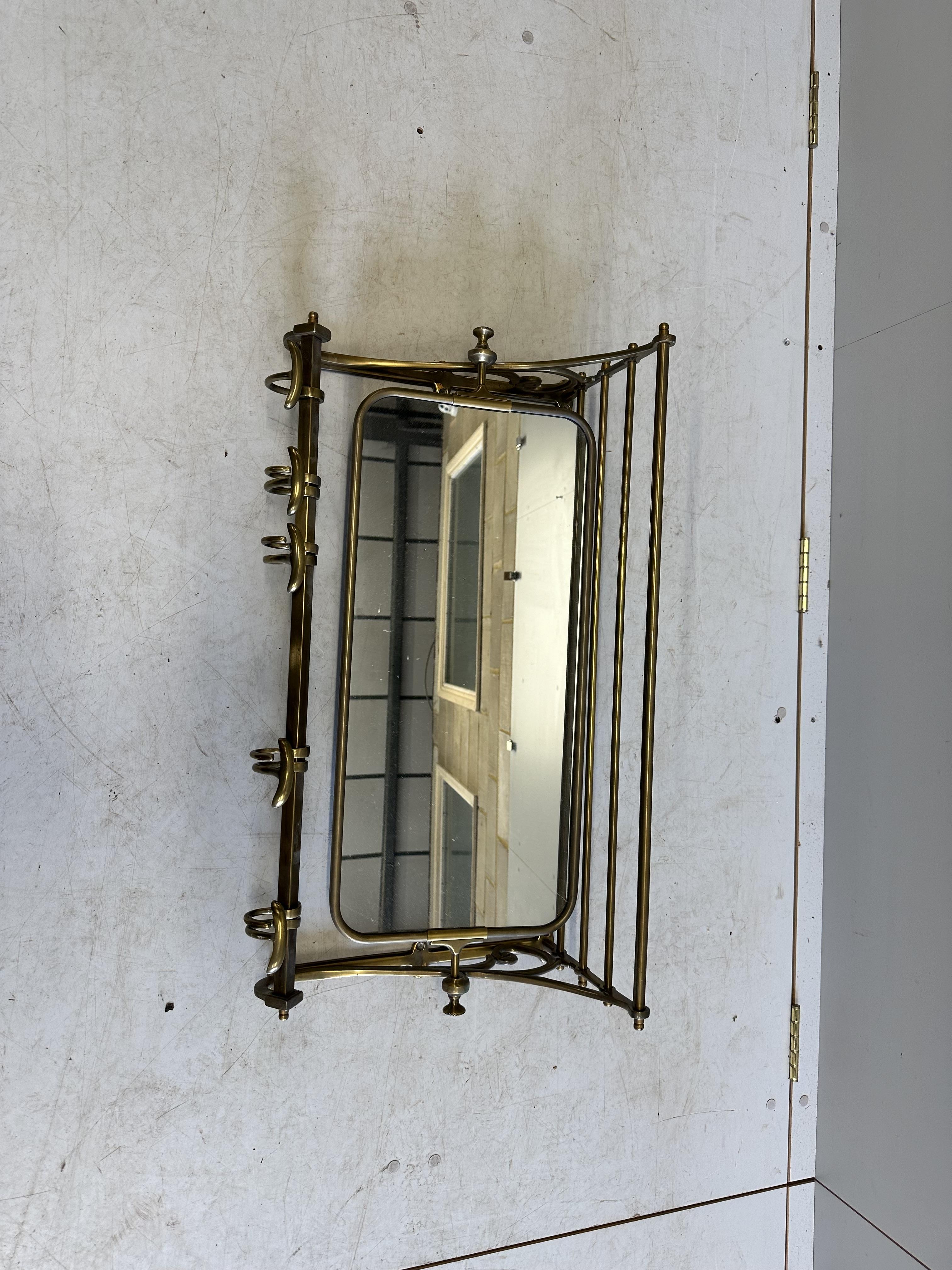 A French mirrored brass hanging coat stand, width 75cm, depth 23cm, height 38cm